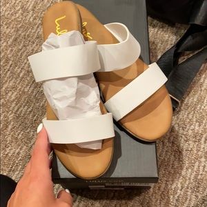 Lulu’s white sandals